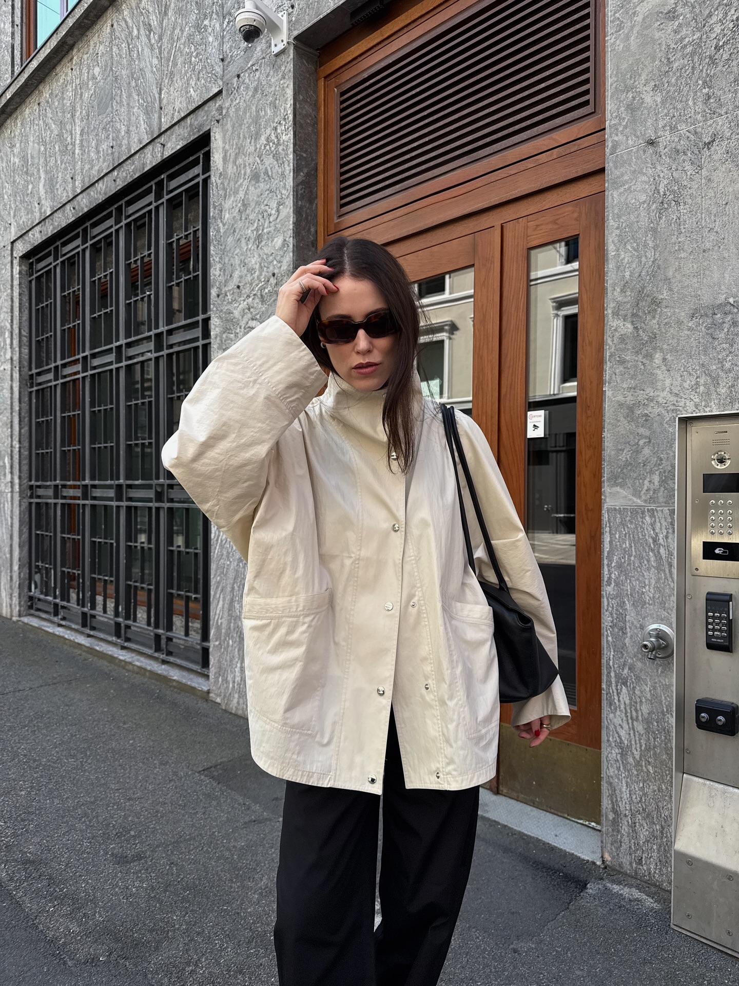 Influencer Annabel Rosendahl wearing a white funnel-neck jacket.