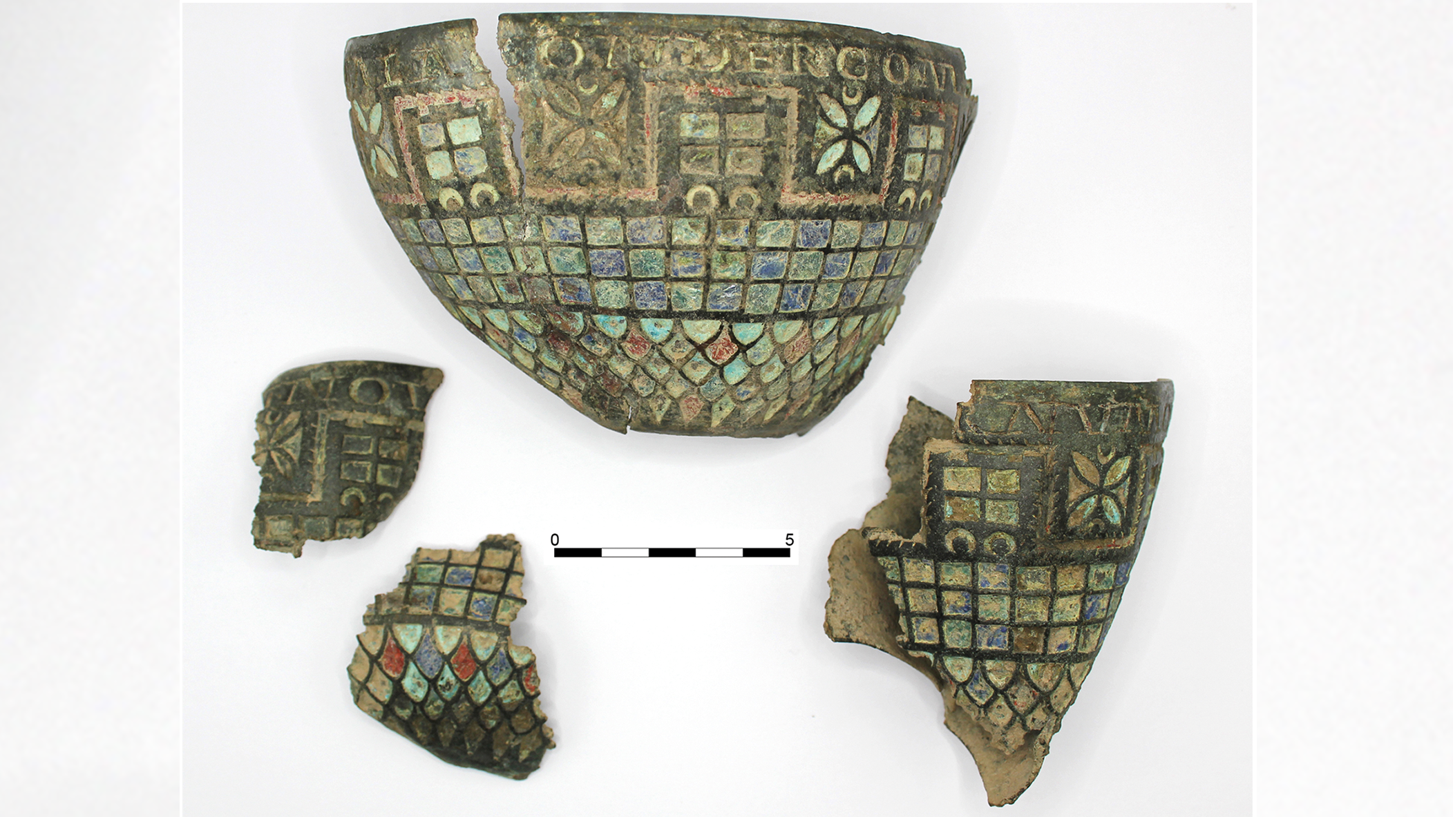 four fragments of a polychrome enameled bronze cup