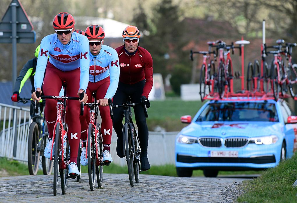 Katusha-Alpecin's Nils Politt and Jens Debusschere ride with team coach Erik Zabel