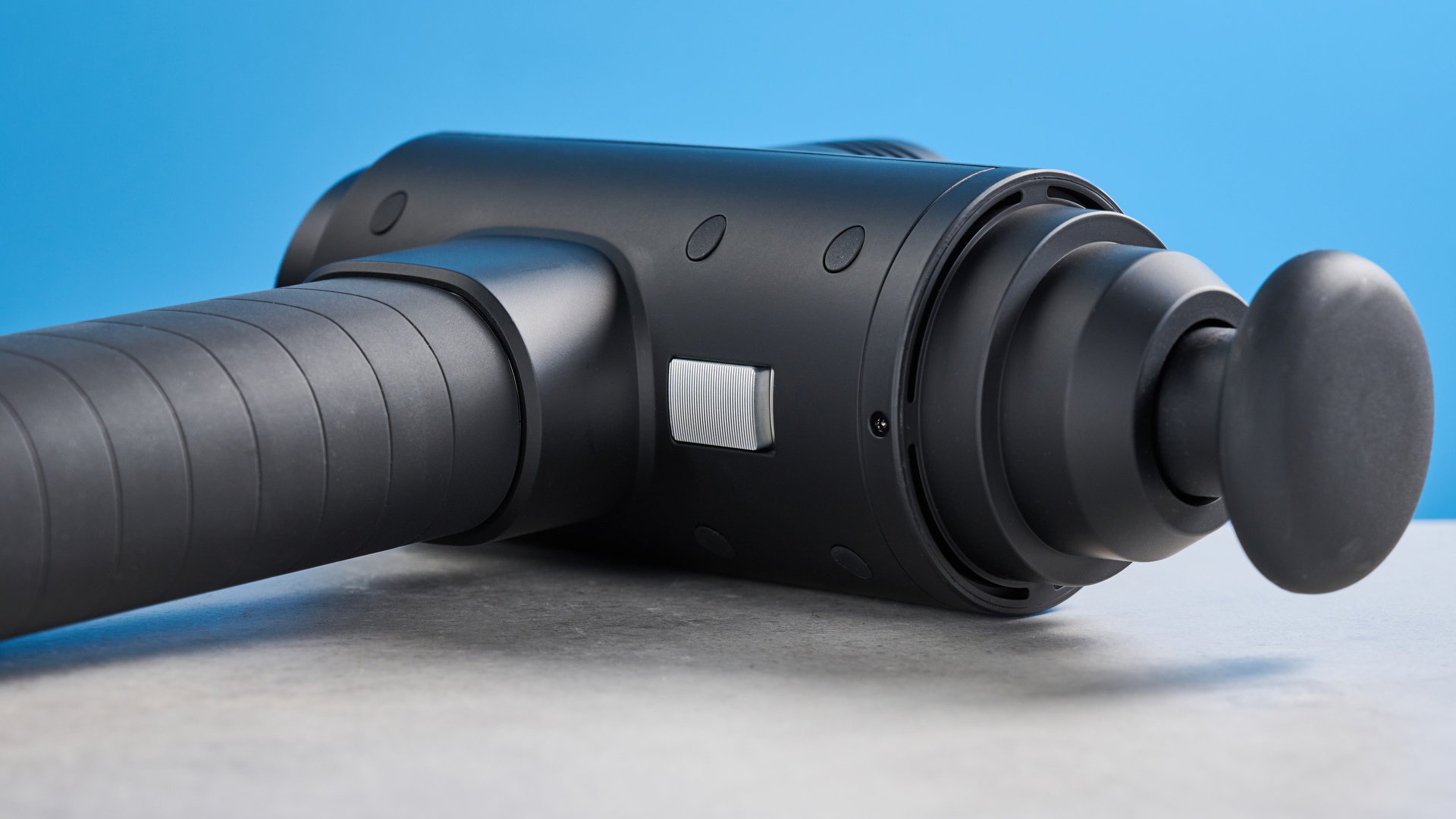the hyperice hypervolt 2 pro massage gun with a long ergonomic handle and interchangeable massage head attachments