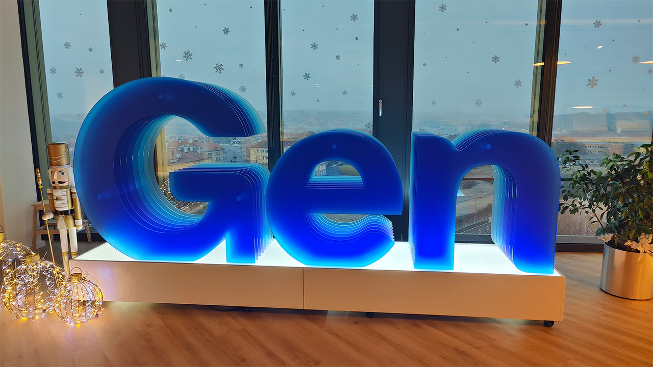 Large blue Gen Digital sign in front of glass window