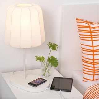 White walls with cushion and lamp