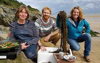 Kate cooking with seaweed on the beach with Caro and Tim of The Cornish Seaweed Company