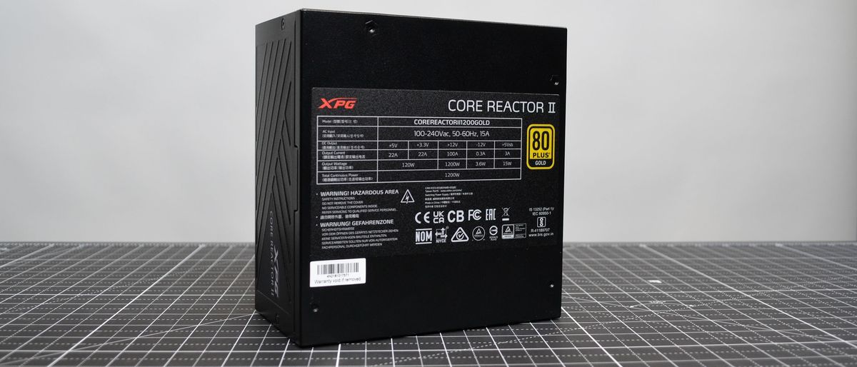 An XPG Core Reactor II 1200W power supply on a desk