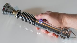 The SabersPro Luke lightsaber being held in the hand.