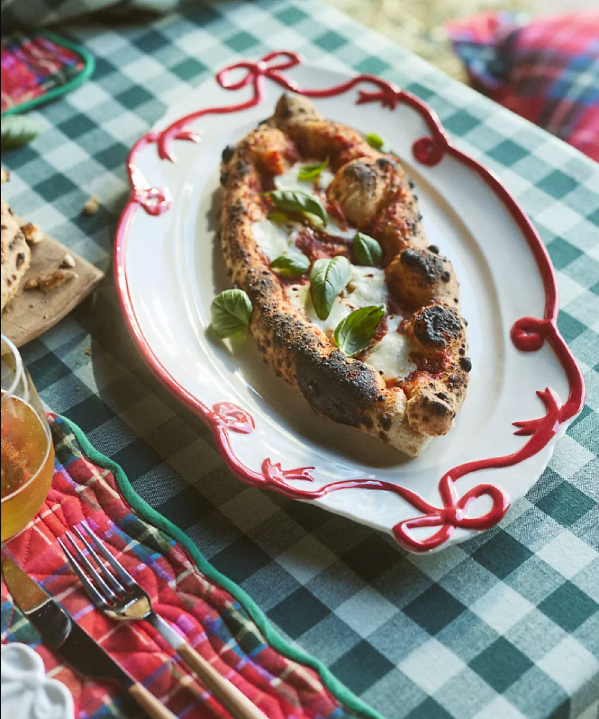 Red bow platter on plaid tablecloth