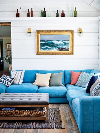 Coastal living room with blue sofa