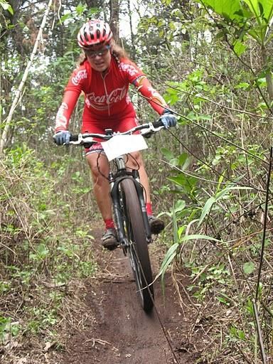 A woman rides Guatemalan singletrack.