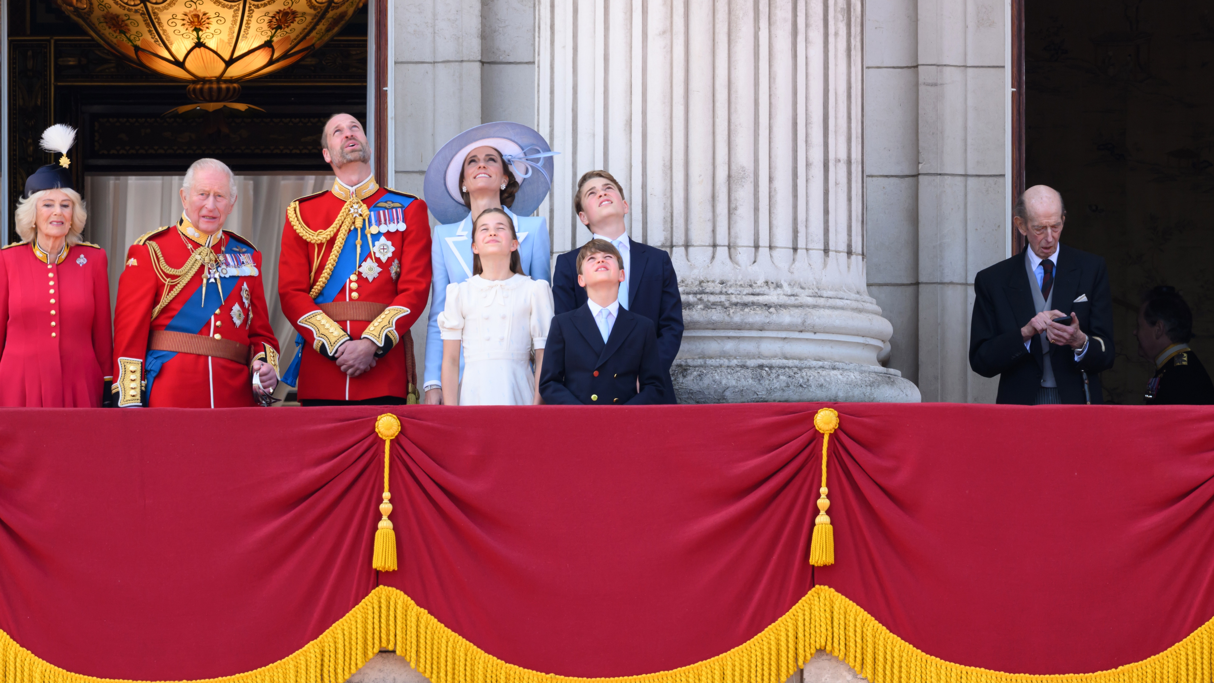 Queen Camilla, King Charles, Prince William, Princess Charlotte, Catherine, Princess of Wales, Prince George, Prince Louis and Edward, Duke of Kent (on his phone) during Trooping The Colour 2026