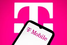 The T-Mobile logo appears on a smartphone screen and as the background on a laptop computer screen