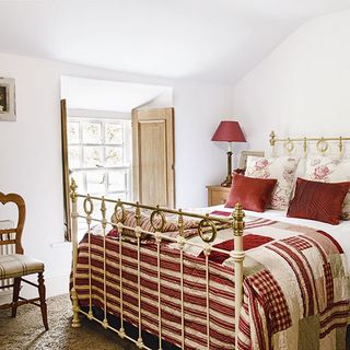 Main bedroom with red and cream accents