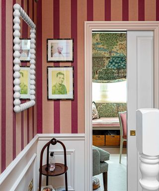 Burgundy and pink striped wallpaper in entryway
