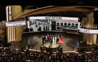 Oscars 2023 stage with cast from everything everywhere all at once accepting best picture award