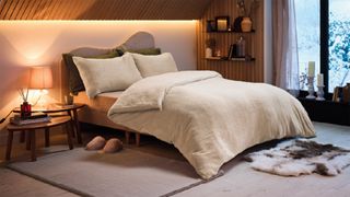 cosy bedroom with layered lighting and Aldi's cosy bedding