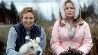Coolidge in pink jacket and white fluffy earmuffs on the right and Carrie Aizley in a blue vest with poodle on the left