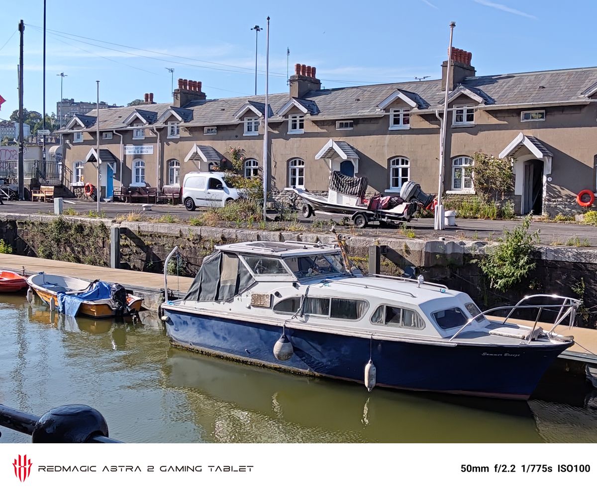 Photos of a boat and a man taken on the RedMagic Astra 2
