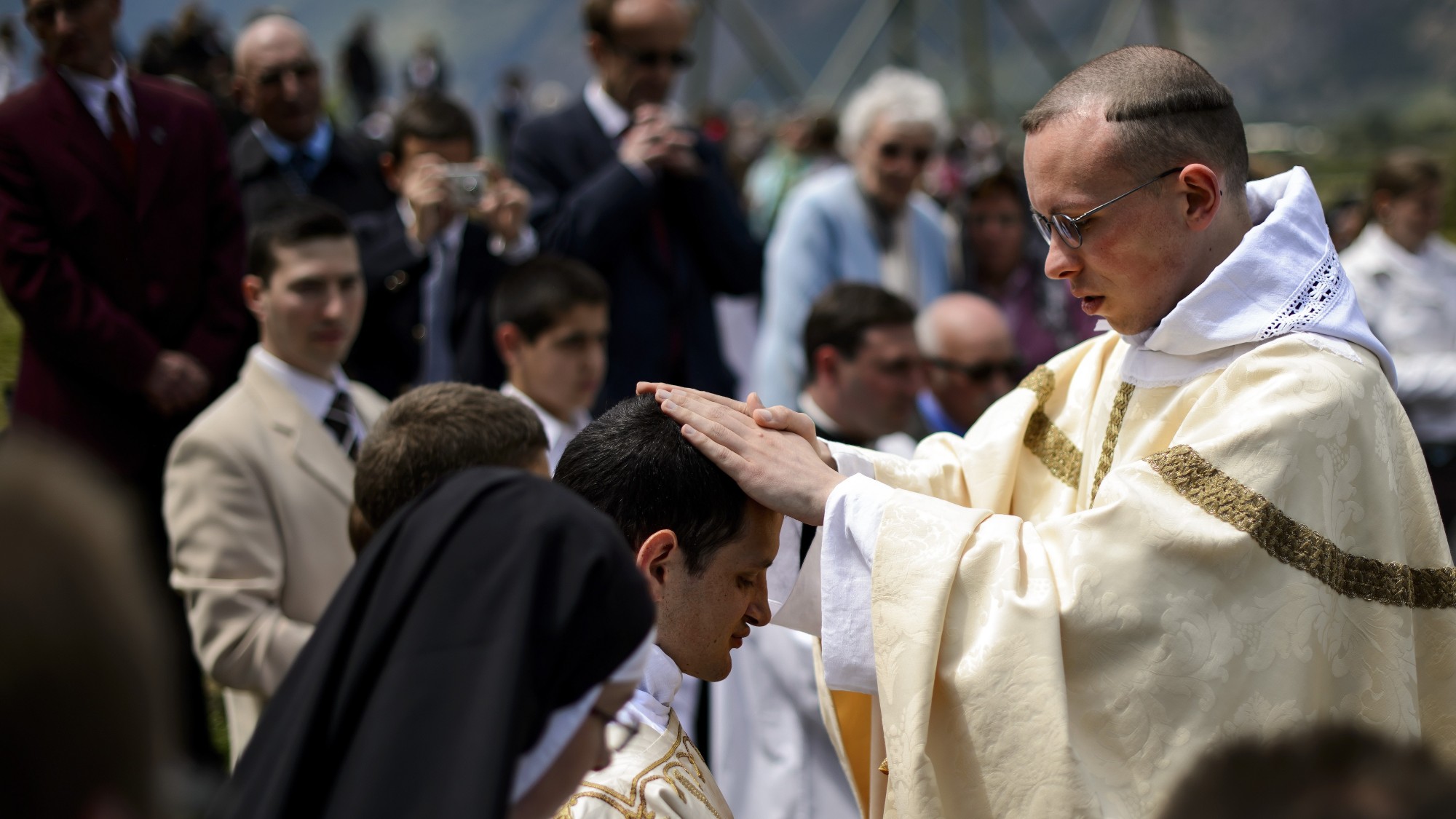 A new priest gives blessing after an ordination mass of the breakaway fundamentalist Roman Catholic Society of St Pius X 