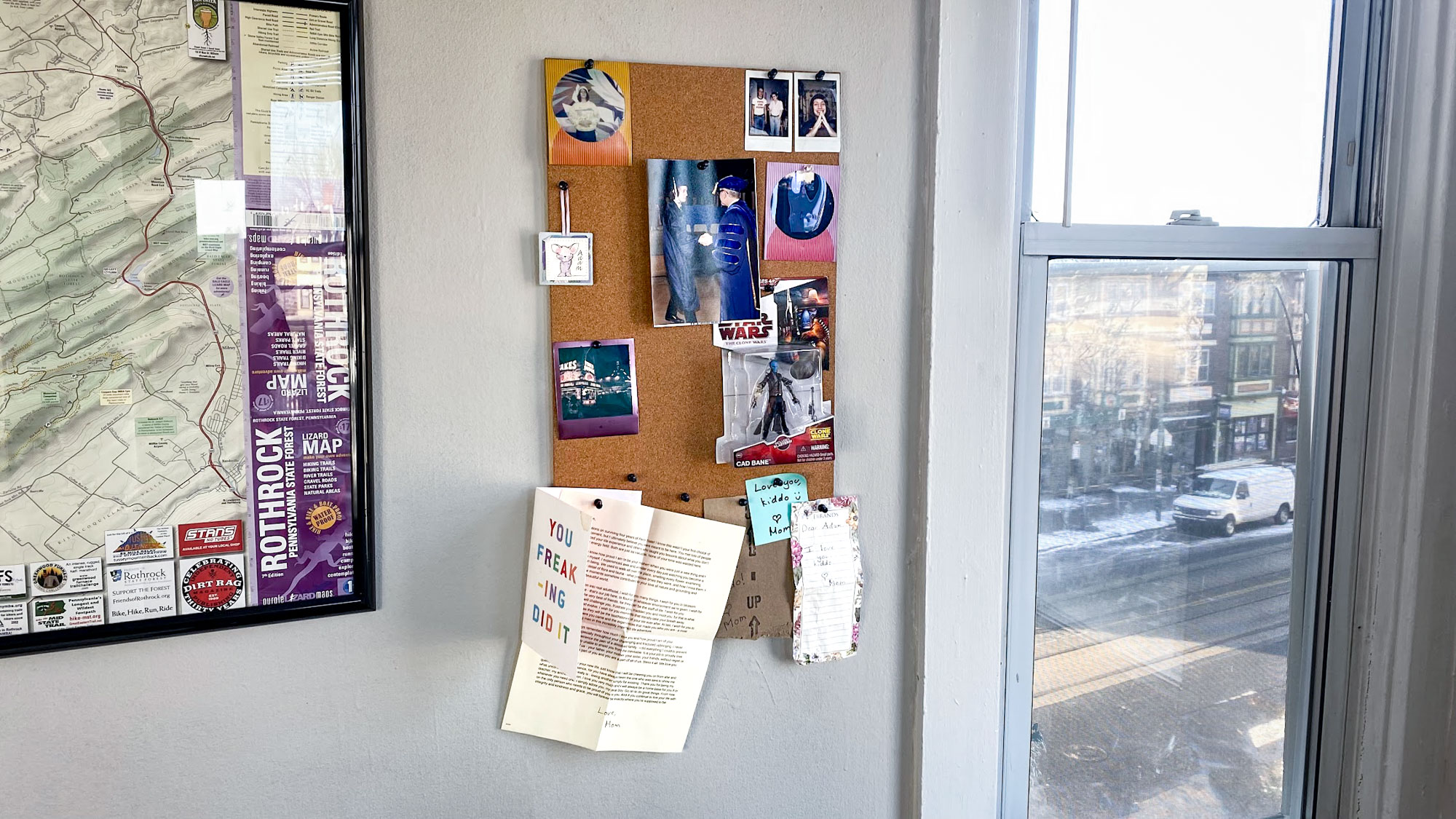 a pegboard covered in keepsakes