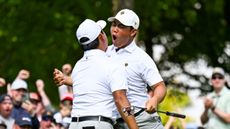 Tom Kim celebrates a putt with Si Woo Kim during day three of the 2024 Presidents Cup