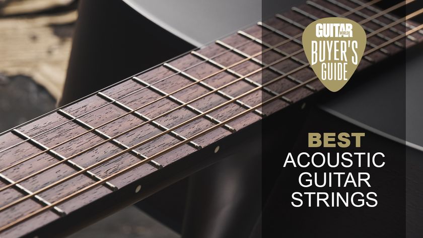 Close up of acoustic guitar strings on a fretboard