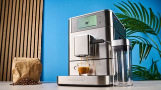 the fully automatic KF8 KitchenAid coffee machine is a stainless steel large coffee machine with a built-in grinder, milk frother, and espresso machine all in one with touchscreen controls