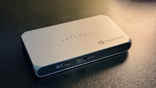 Satechi Thunderbolt 4 Slim Pro Hub on a funky-ass black desk wit Mac n' accessories