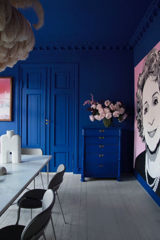 A dining room color drenched in blue