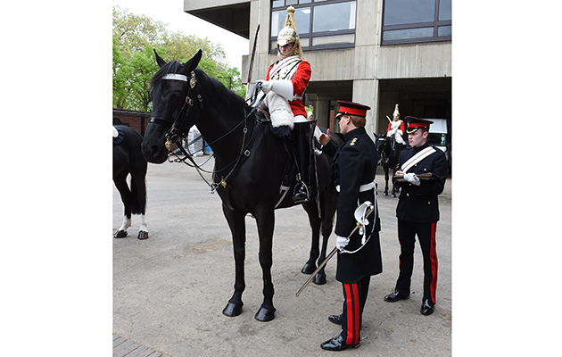 Inspection time: an officer checks that all kit is in order at 10am before the soldiers go on guard