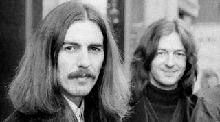 George Harrison, Eric Clapton and (cropped out) Delaney Bramlett, of Delaney & Bonnie, leave the Midland Hotel, in Birmingham, England, on their way to perform at the Town Hall, December 3, 1969.