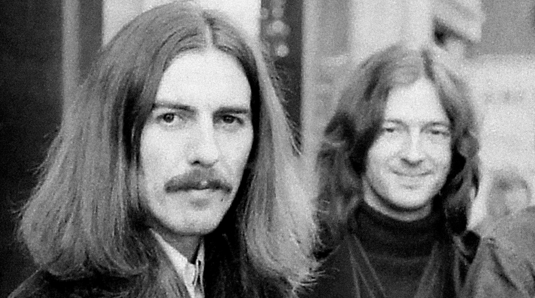 George Harrison, Eric Clapton and (cropped out) Delaney Bramlett, of Delaney &amp; Bonnie, leave the Midland Hotel, in Birmingham, England, on their way to perform at the Town Hall, December 3, 1969. 