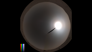 "fish eye" style image, with bright ringed sun to the right and a ring of Martian terrain