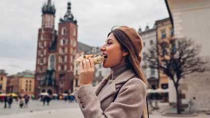 Woman eating a Bagel 