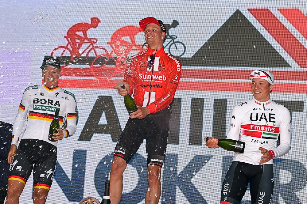 Cees Bol celebrates on the Nokere Koerse podium with Pascal Ackermann and Jasper Philipsen