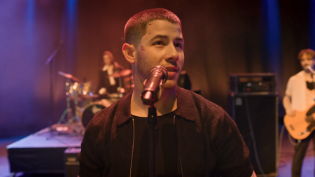 Nick Jonas on stage in Power Ballad