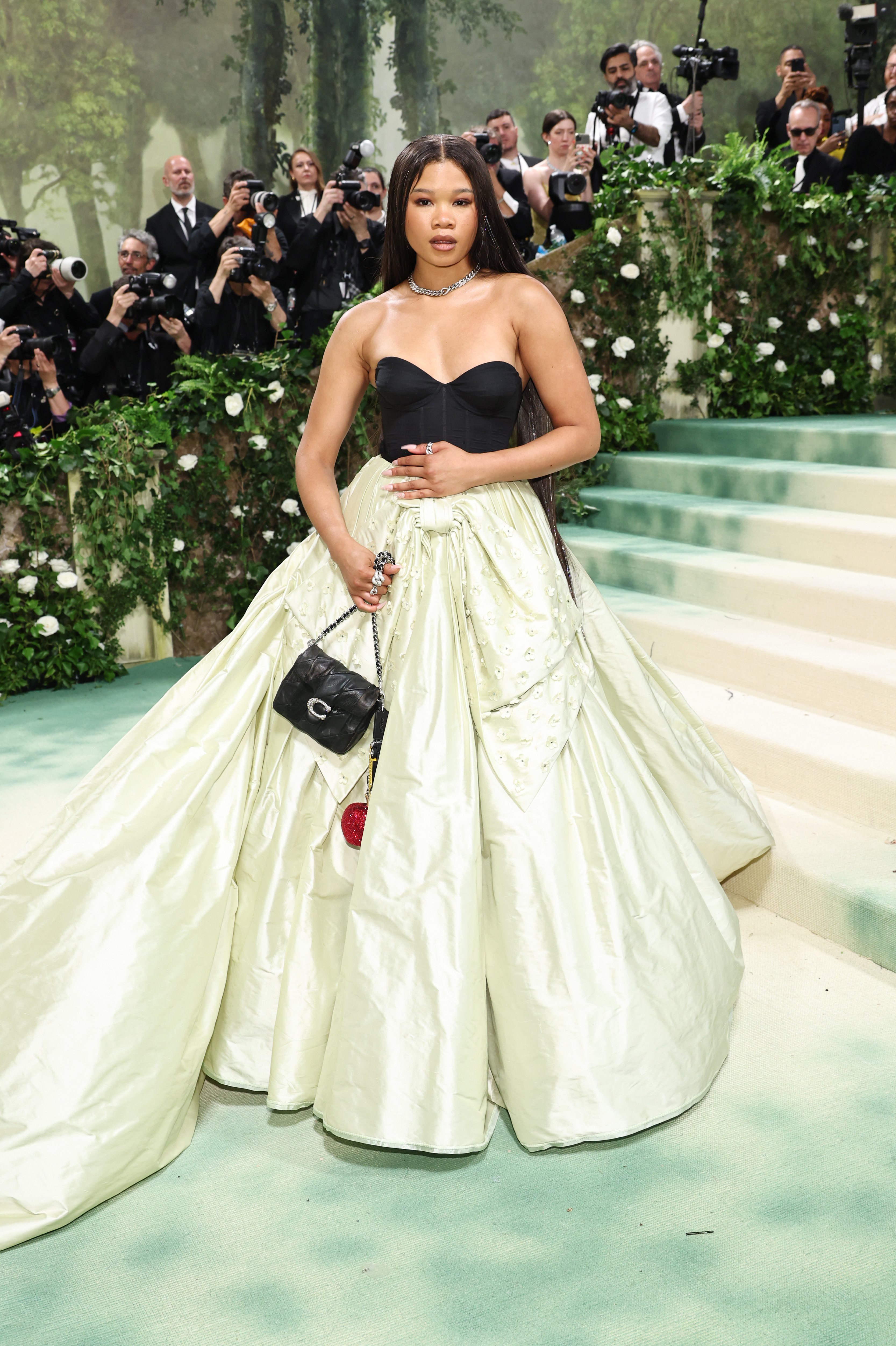 Storm Reid attended the 2024 Met Gala in a custom Coach ballgown and a small Tabby bag