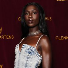 Jodie Turner Smith wearing a washed denim dress with a choker