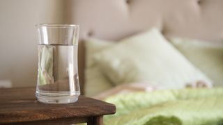 Glass of water next to the bed