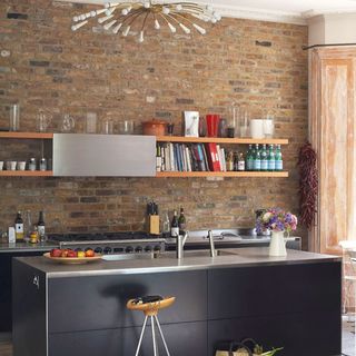 kitchen with bricked wall and wall shelf