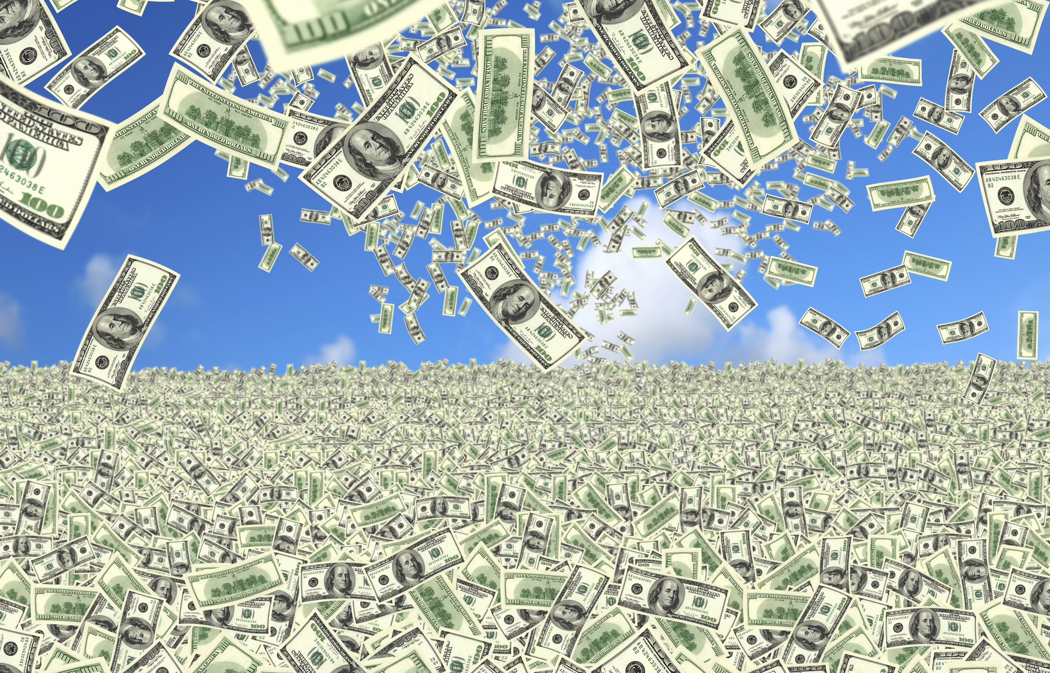 falling 100 dollar bills over money field.