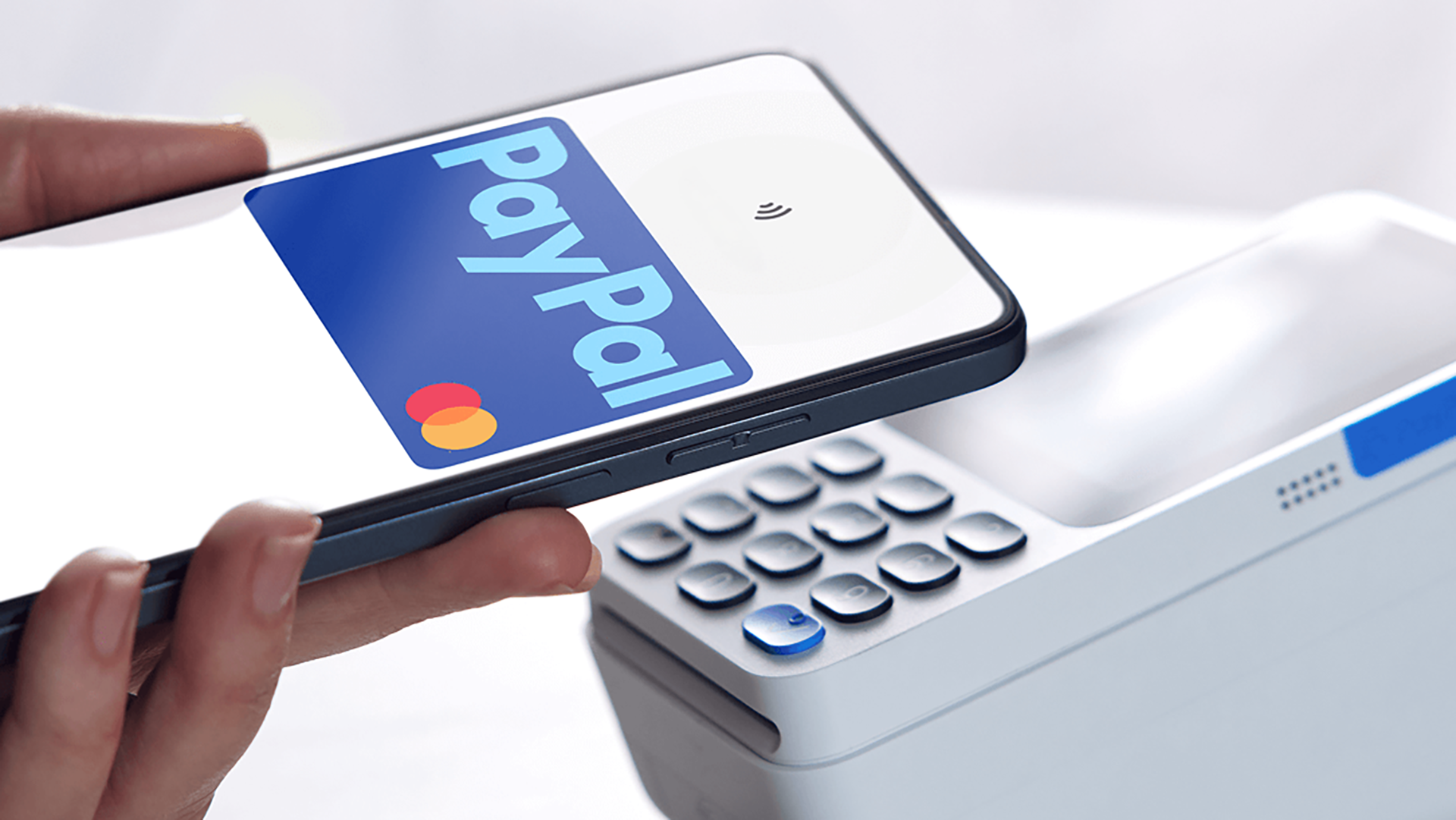 PayPal debit card being used on a phone