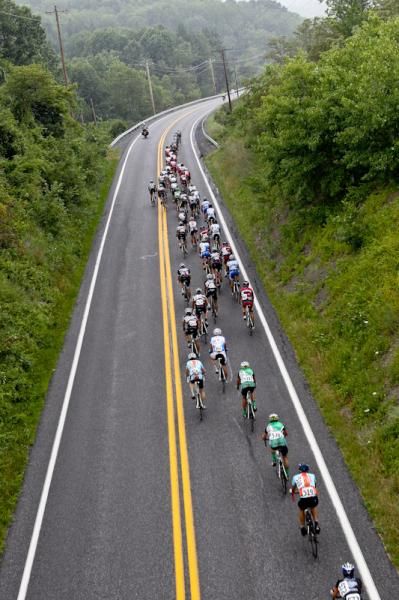 The men's field heads toward the feed zone as the weather gets iffy.