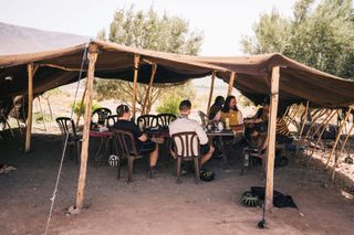 Lunch under a tarp, a welcomed relief from the baking sun