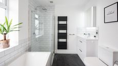 White bathroom with black towel rack