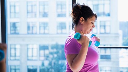 Woman working out with dumbbells