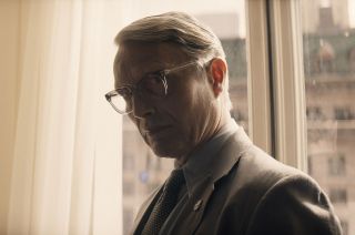Jürgen Voller, a.k.a. Dr. Schmidt (Mads Mikkelsen), seen here wearing a NASA lapel pin, is a former Nazi scientist who led development of the rocket that took the Apollo astronauts to the moon in "Indiana Jones and the Dial of Destiny," now playing in theaters.