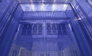 Image of a close up section of the house made from translucent fabric in blue