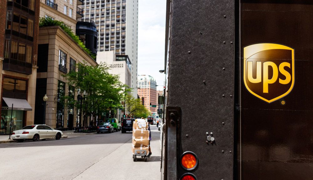 The rear gate of a UPS truck during a delivery run on a Chicago city street.