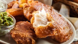 Beer battered fish and chips with peas