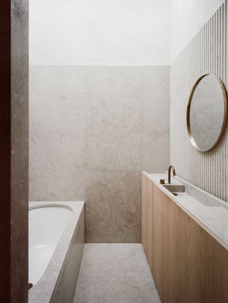 Minimalist bathroom at London house by Architecture For London