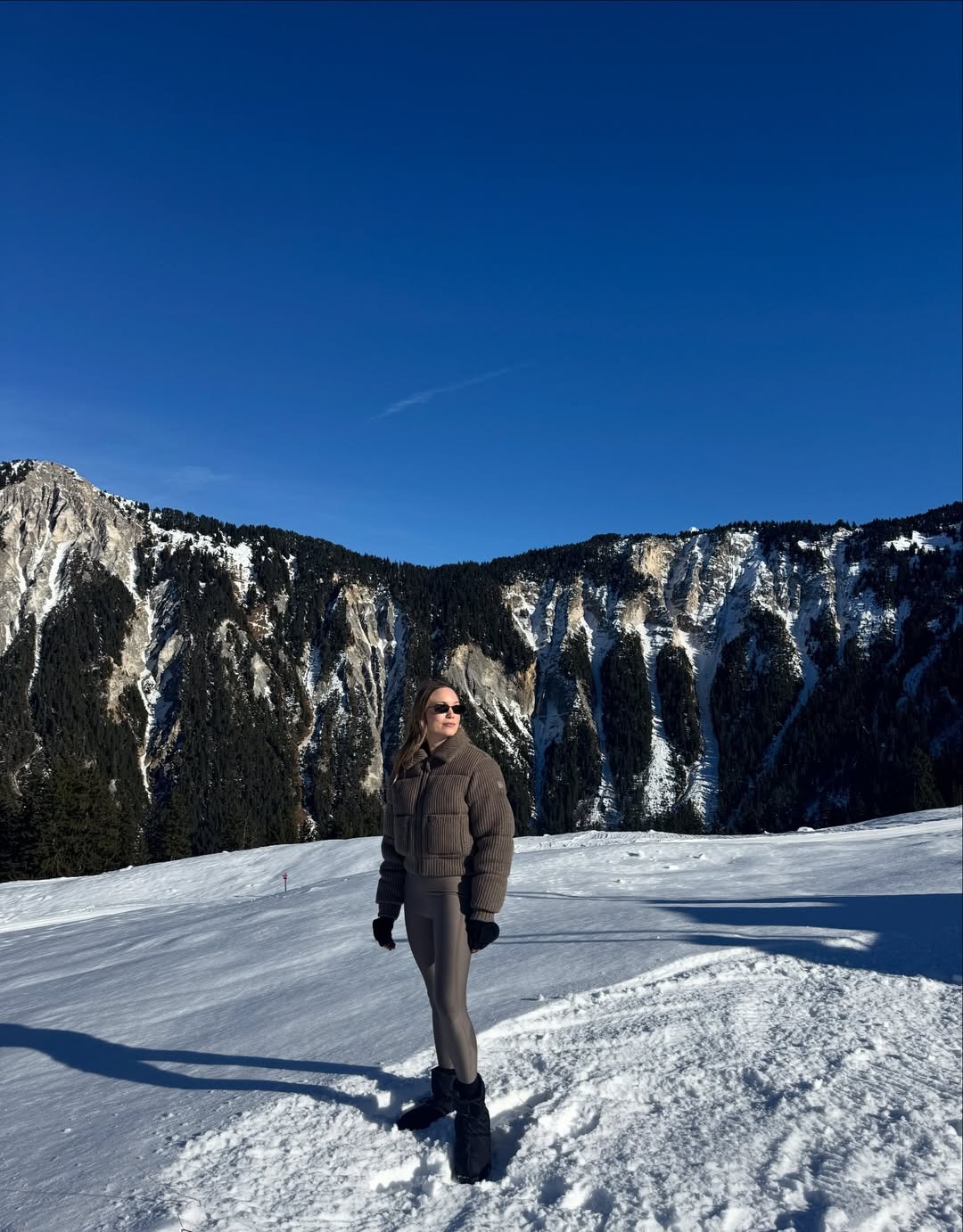 @michaelabushkin poses in an Alo puffer at the French Alps